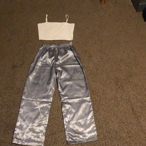 White crop top with light blue glossy pants